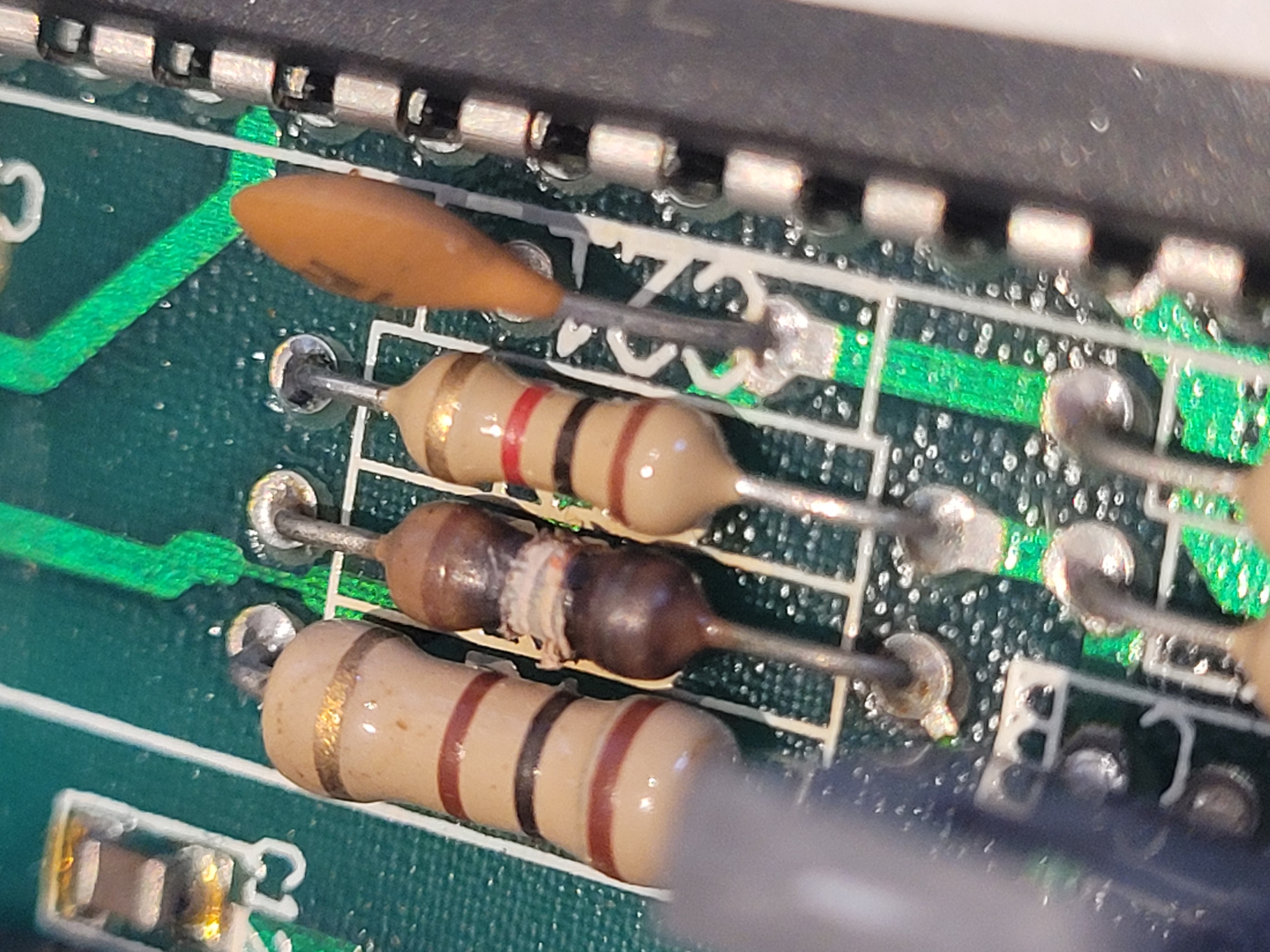 Damaged R20 resistor — heat discolouration visible
