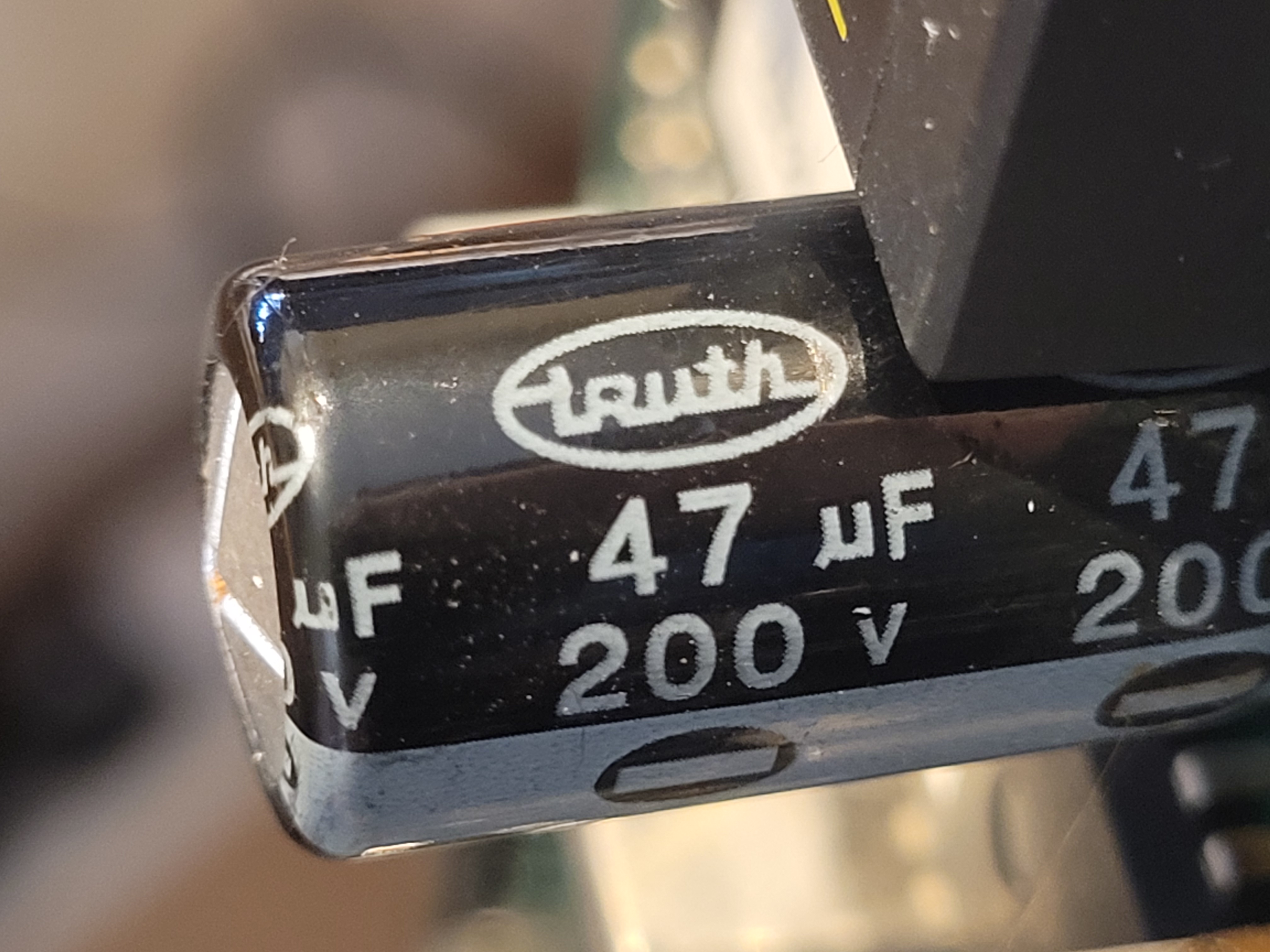 Domed C22 capacitor showing failure